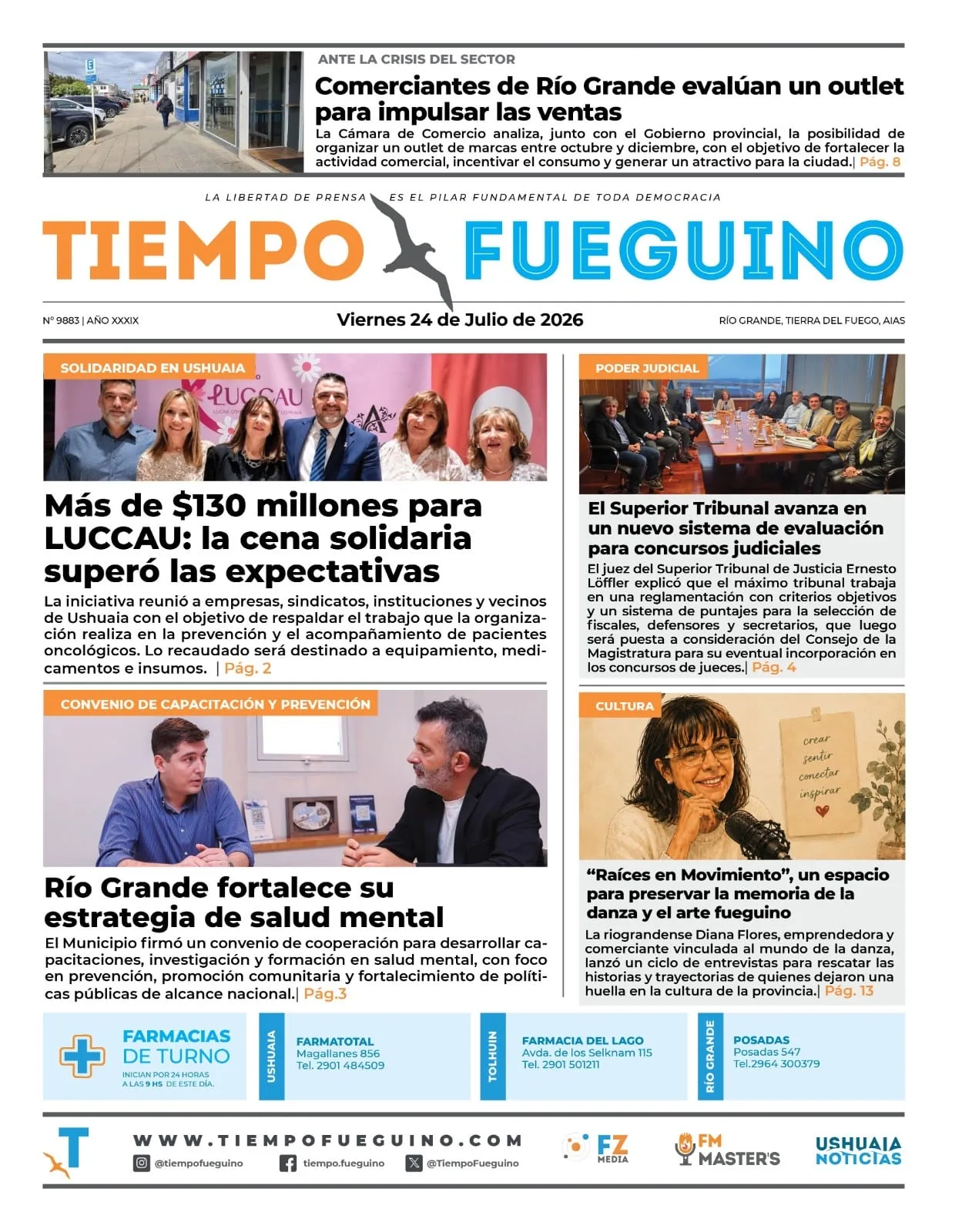 Diario de Tierra del Fuego abierto sobre mesa de madera con portada visible y café al lado